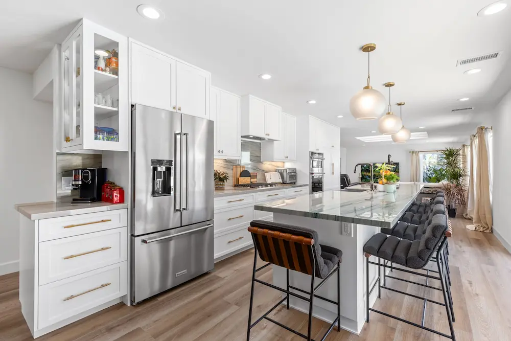 San Diego kitchen remodel with white cabinets, marble island and pendant lighting
