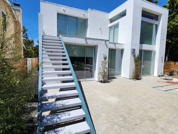 Water intrusion repair project in Del Mar featuring updated second floor deck and patio area