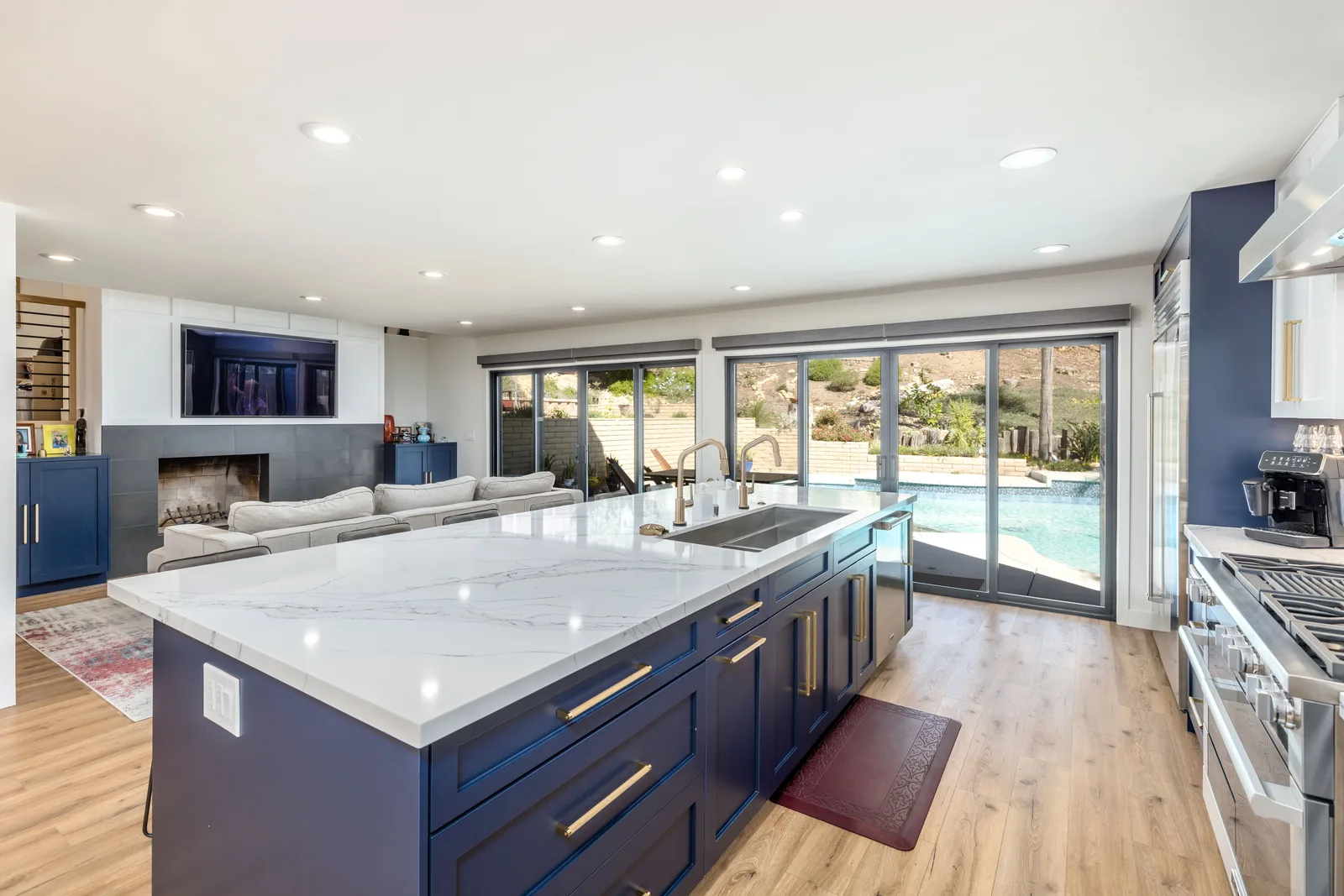 Open-concept living and kitchen framed to the pool, Scripps Ranch remodel